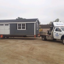 A large shed on a delivery truck.